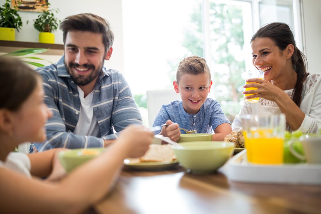 Happy family having breakfast